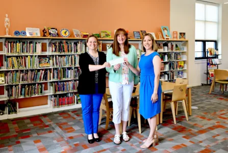 Group donates $8,000  for reading program